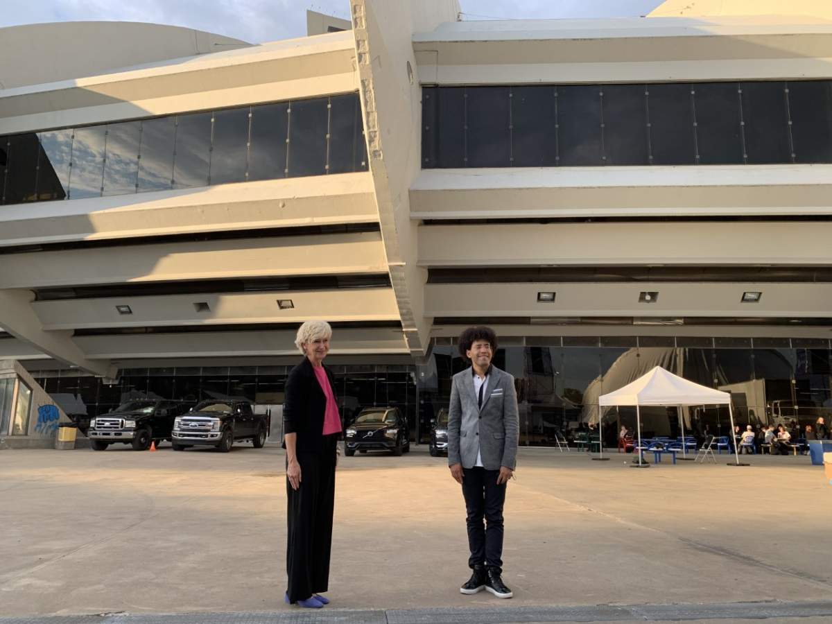 Maestro Rafael Payare is welcomed by Isabelle Brais, the wife of Quebec's premier at Montreal's Olympic Stadium.