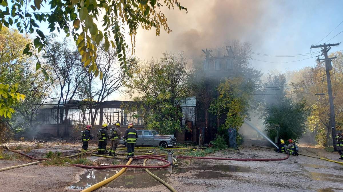 Firefighters battle a Point Douglas blaze Tuesday.