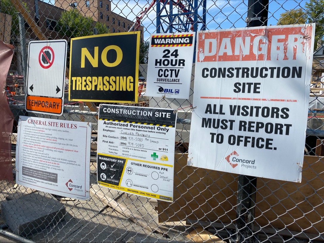 signs warning public not to trespass onto the property where the crane is.