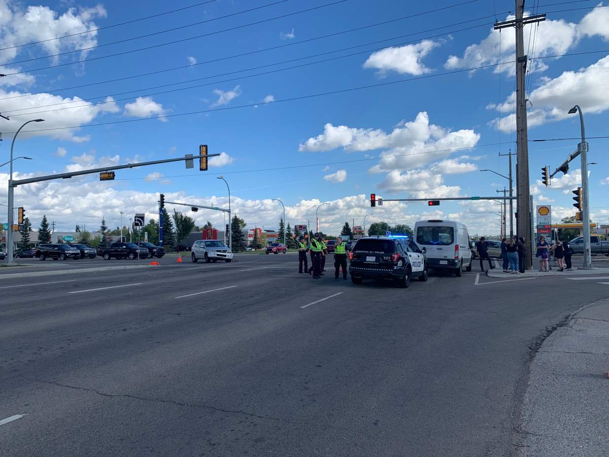Edmonton police investigate a hit-and-run collision involving a vehicle and two elderly pedestrians near 50 Street and 101 Avenue, Sept. 10, 2021.