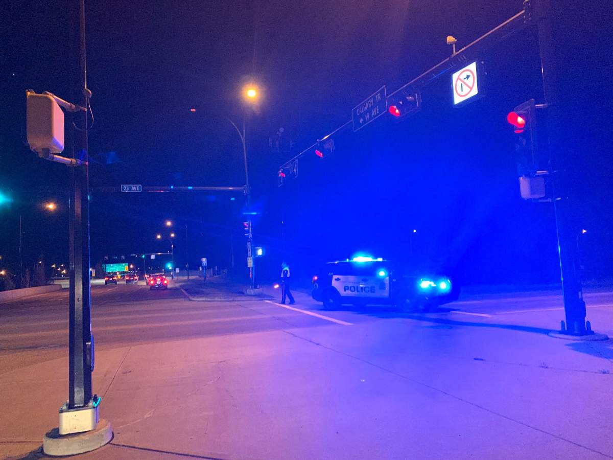 Edmonton police on the 23 Avenue overpass at Calgary Trail on Thursday, Sept. 23, 2021. 