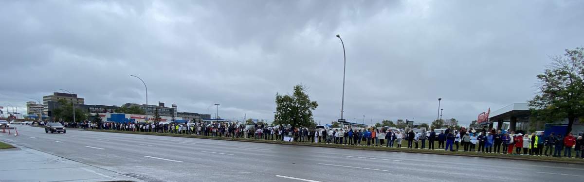 Protesters opposed to mandatory vaccinations gather in Edmonton on Sunday, Sept. 12, 2021.