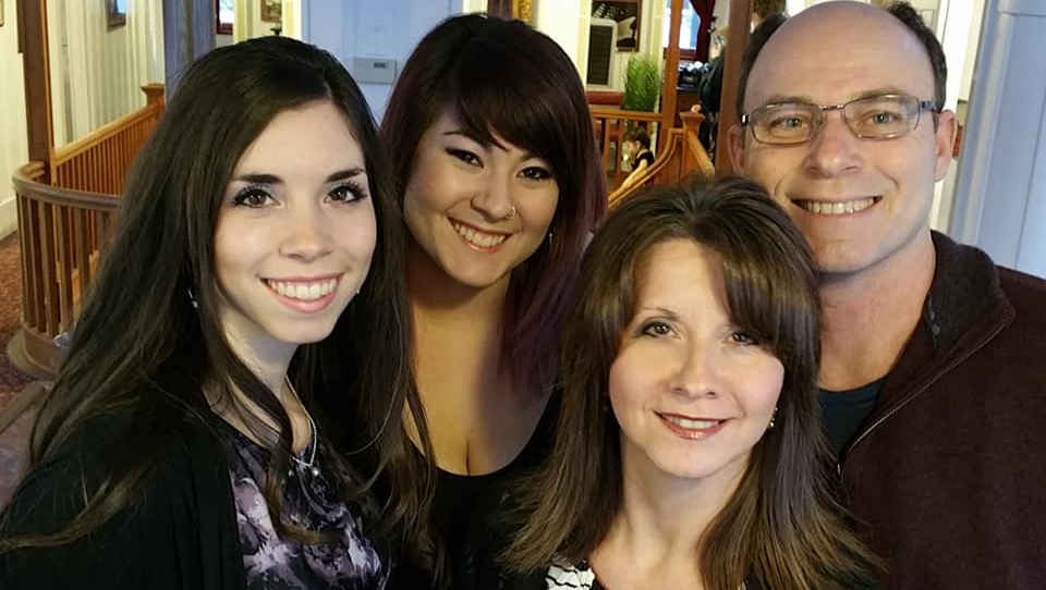 A photo of Nelson Vokey of Penticton, right, and his family. One of his daughters says he had been paralyzed before and recovered, but that vibrations from a golf swing earlier this month wound up leaving him paralyzed again.