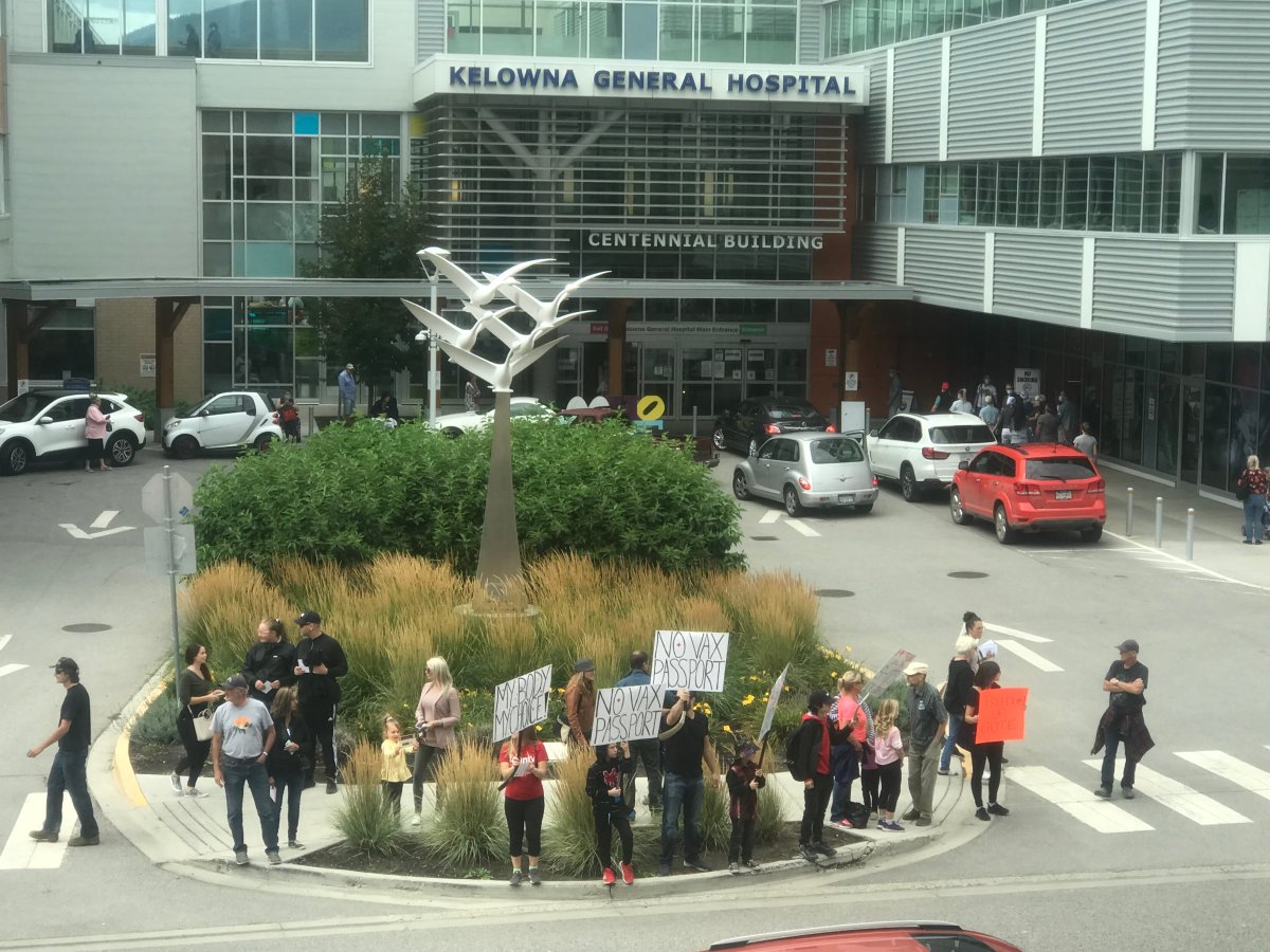 More than 1,000 people gathered in front of Kelowna General Hospital on Wednesday afternoon to protest provincial COVID-19 protocols, including this small group.