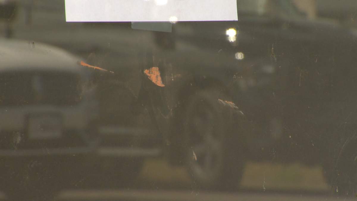 Three weeks after the alleged incident, scuff marks are still visible on the glass door of Cardy’s office.