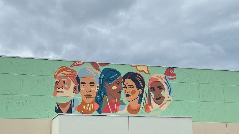 The mural, as seen while being created on Tuesday, Aug. 31, 2020. The mural stems from what police called a hate-motivated vandalism incident involving a local home in July 2020.