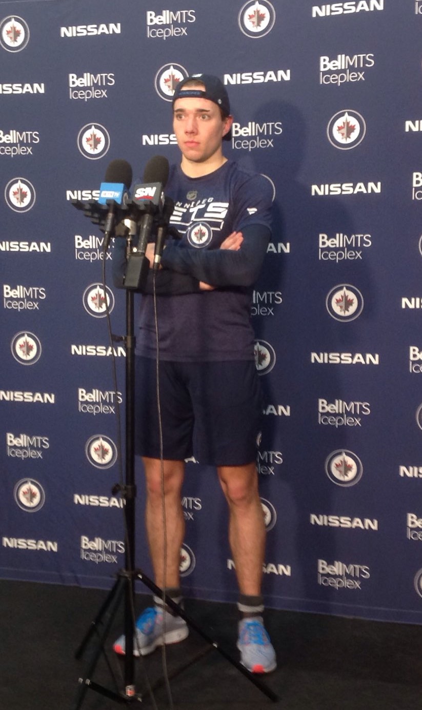 Defenceman Ville Heinola prepares to speak to the media following day two of Jets pro mini camp at Bell MTS Iceplex/Kelly Moore