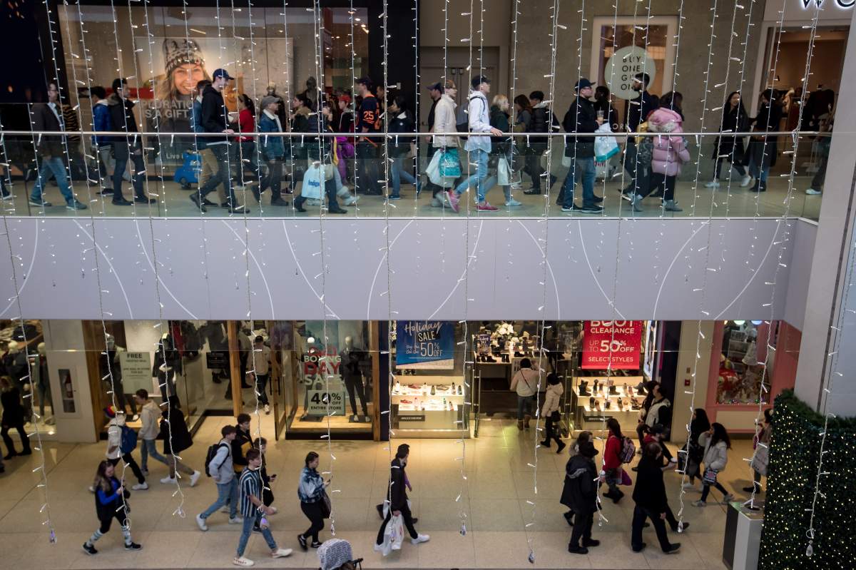 Boxing Day shoppers make their way through West Edmonton Mall in Edmonton, Thursday, Dec. 26, 2019.