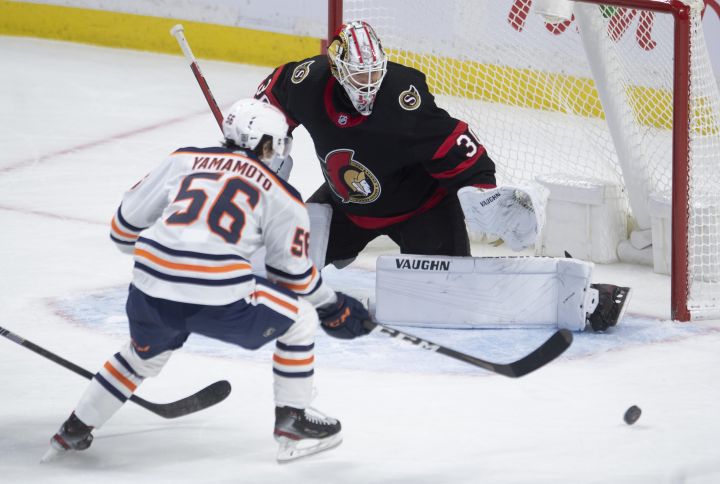 Edmonton Oilers right wing Kailer Yamamoto tries to put the puck past Ottawa Senators goaltender Matt Murray during second period NHL action Monday February 8, 2021 in Ottawa.