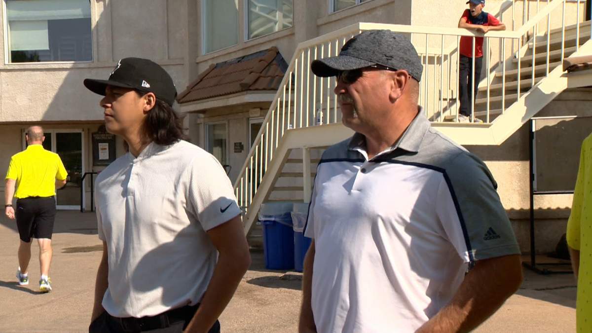 Professional hockey player Ethan Bear (left) and former NHLer Wendel Clark (right) at Drive for Kids in Saskatoon.