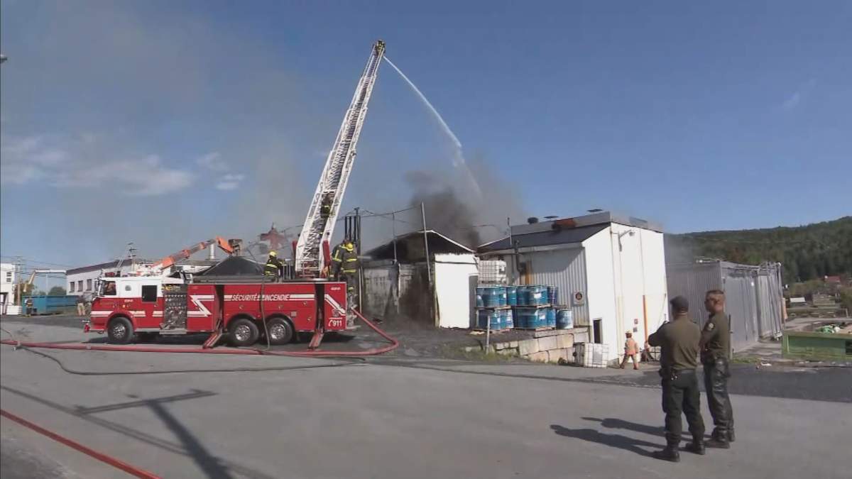 Firefighters tackle a deadly blaze in Beauceville on Monday, Sept. 20, 2021.