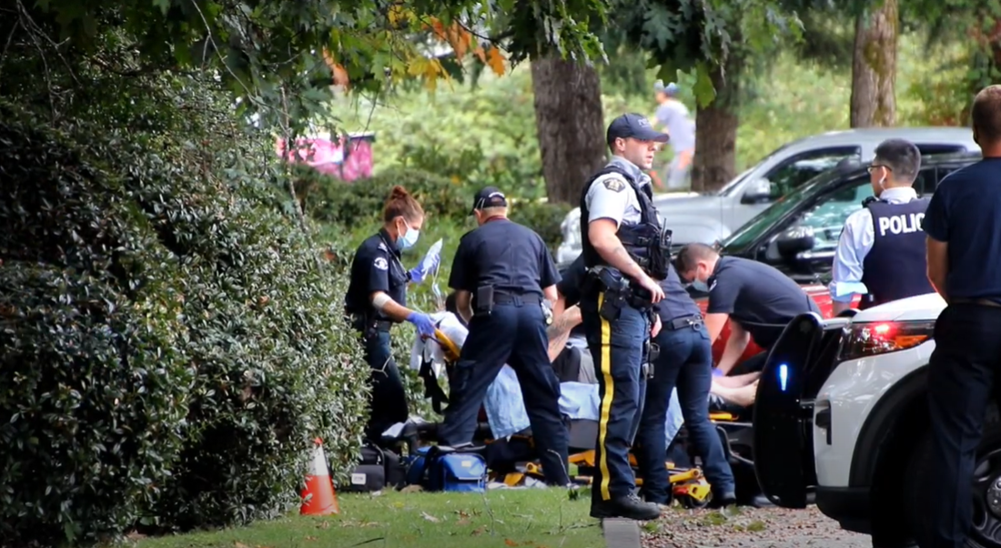 First responders attend to a shooting victim in Burnaby on Saturday, Sept. 18.