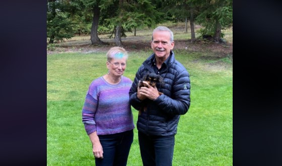 Debbie Robinson and Chris Hadfield posed for a quick snap after he adopted the adorable spaniel Henry into his family.