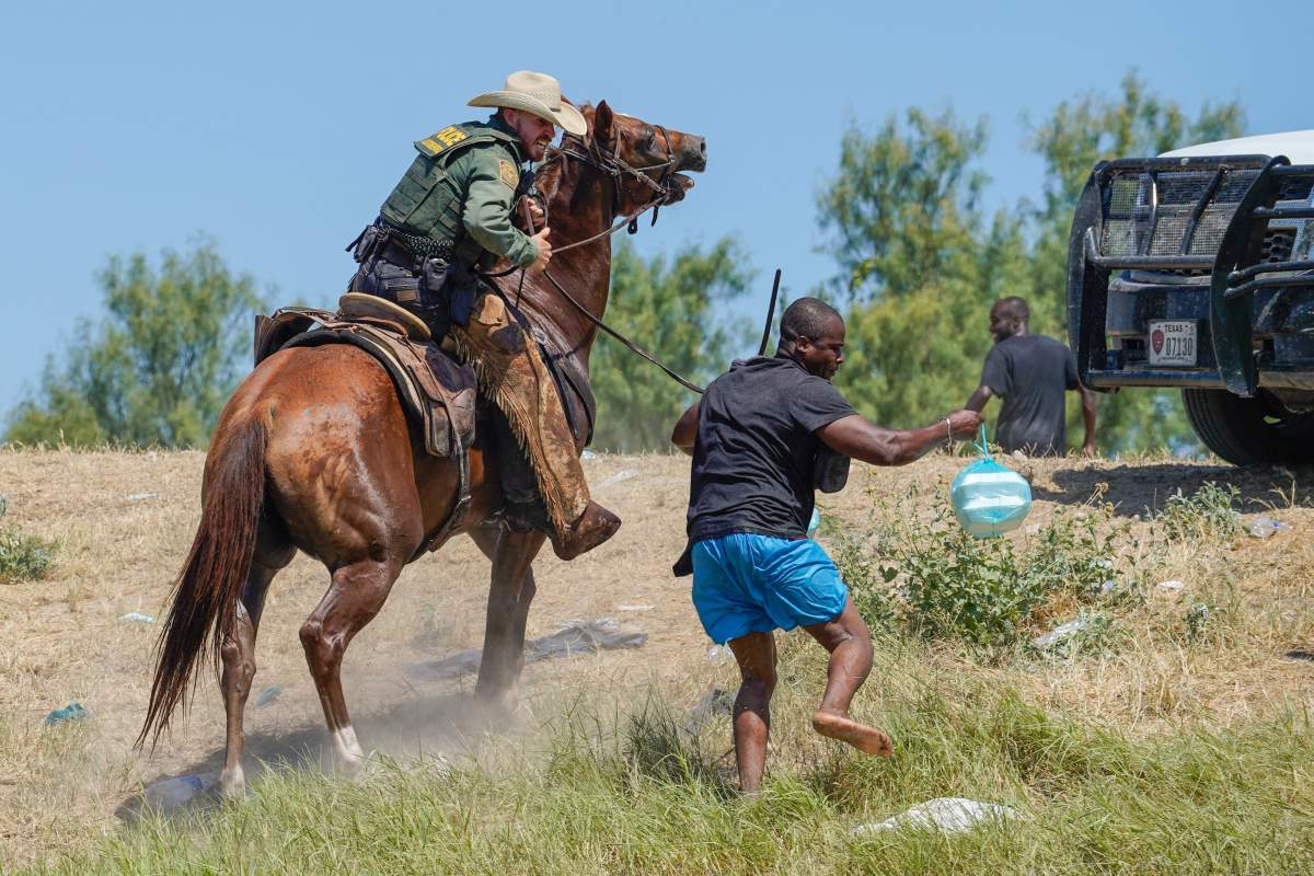 Haitian migrant appears to be lassoed by U.S. Border Patrol agent