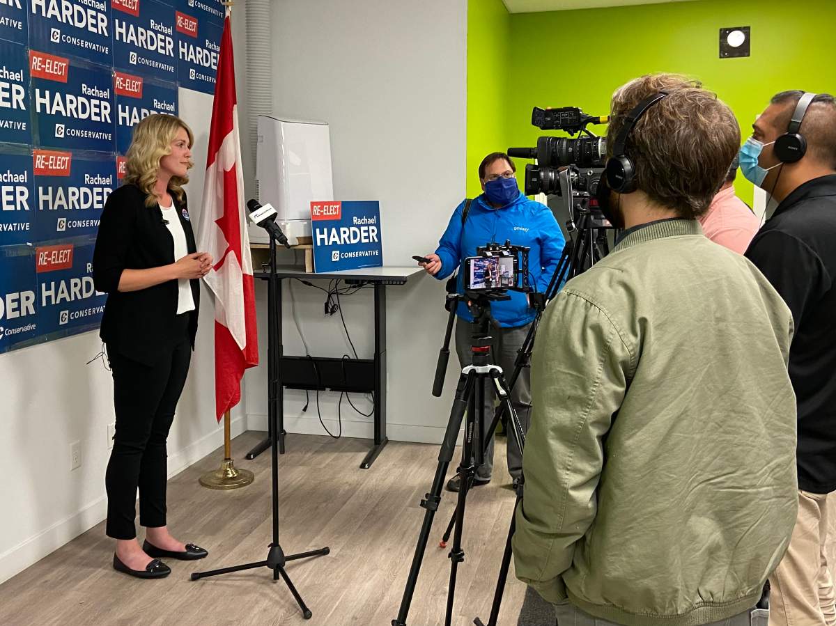 Conservative incumbent Rachael Harder speaks to reporters on Election night.