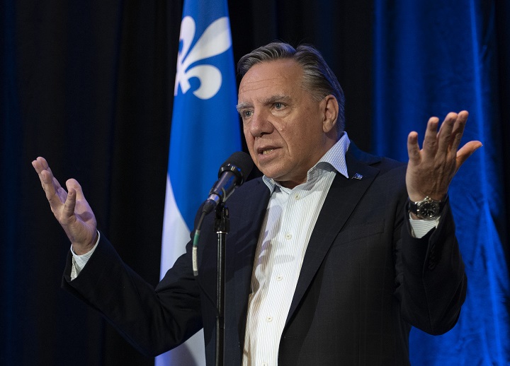 Quebec Premier Francois Legault responds to reporters questions over the federal election debate, before entering a pre-session party caucus Thursday, September 9, 2021  in Quebec City. 