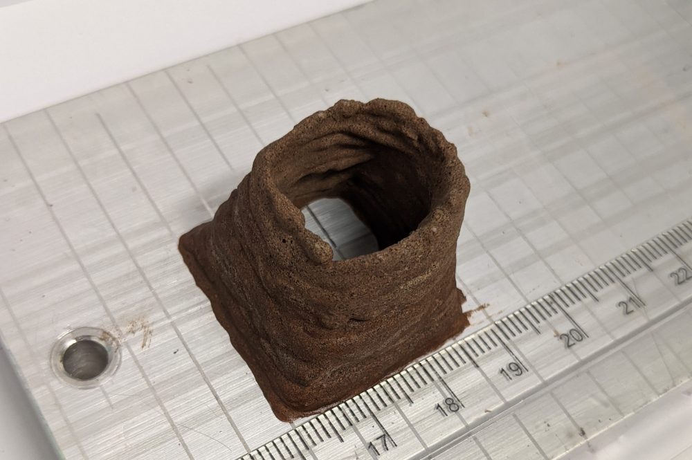 A piece of AstroCrete made from blood and dust is shown at a lab in the United Kingdom.