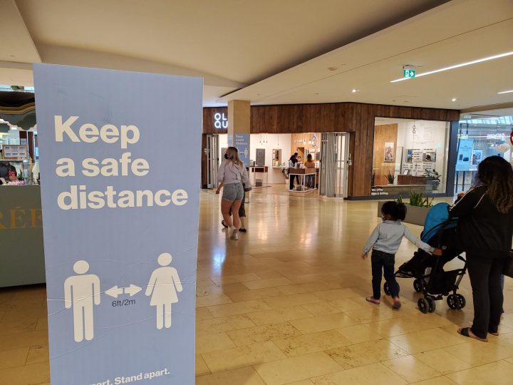 A sign advising people to physically distance is seen at Square One in Mississauga during the COVID-19 pandemic on Sept. 3, 2021.