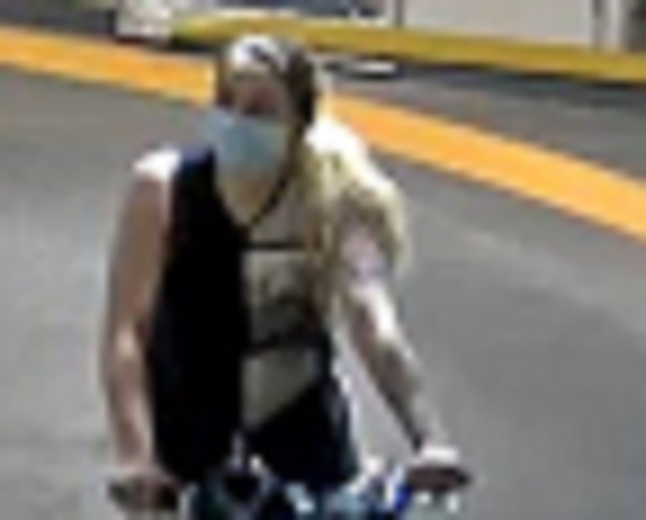 Surveillance image of a woman wanted for allegedly stealing a U of T truck.