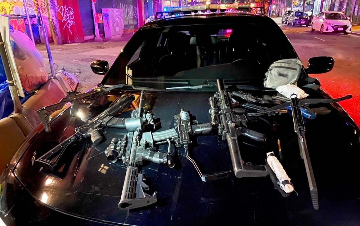 Vancouver police display real and imitation weapons seized from a Downtown Eastside building after a homeless man was shot with an arrow on Thursday. 