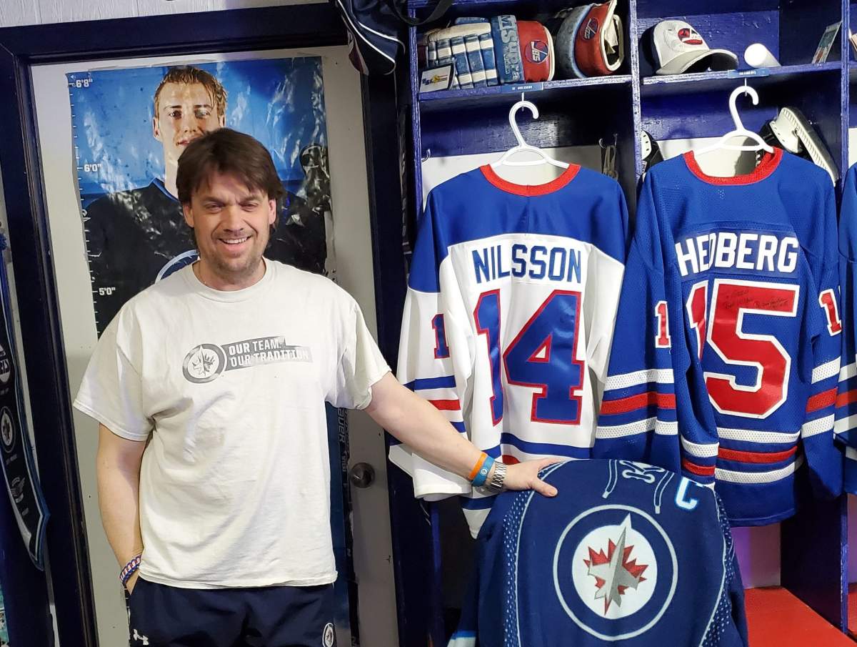 Greg Burnett in his Winnipeg Jets basement.