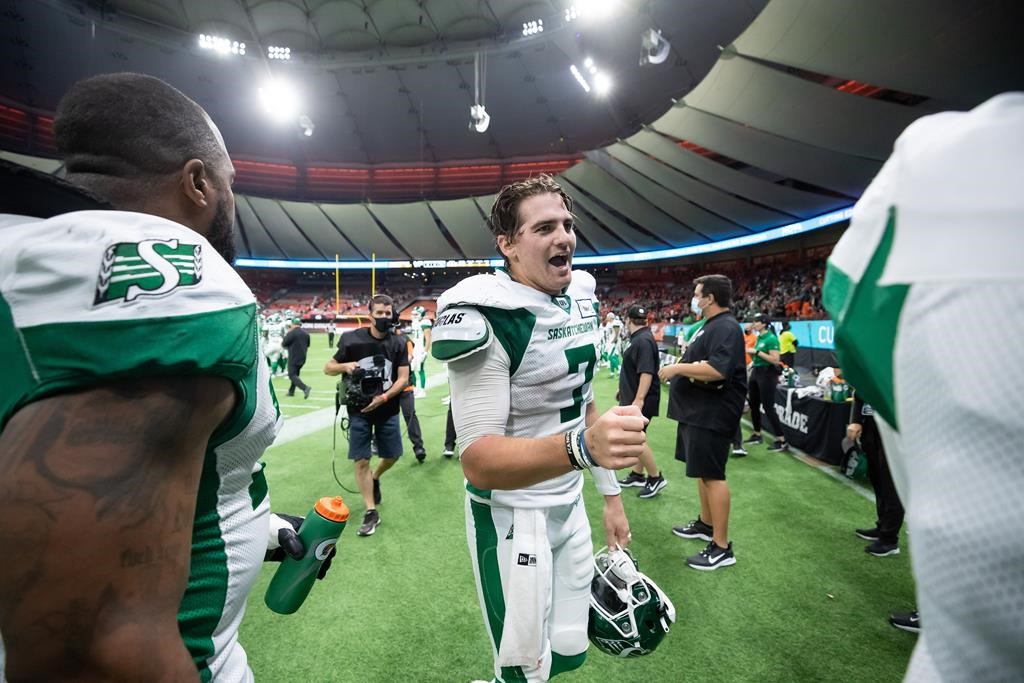 Saskatchewan Roughriders quarterback Cody Fajardo celebrates after scoring the game-winning touchdown against the B.C. Lions during the second half of a CFL football game in Vancouver, on Friday, Sept. 24, 2021. Fajardo, defensive back Shaquille Richardson and running back William Stanback were named the CFL's weekly top performers Tuesday. THE CANADIAN PRESS/Darryl Dyck.