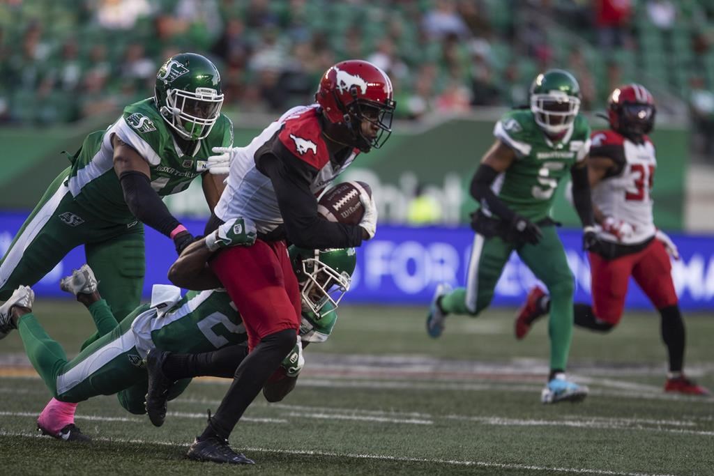 Calgary Stampeders wide receiver Hergy Mayala (1) runs the ball against the Saskatchewan Roughriders during the first half of CFL football action in Regina on Saturday, October 9, 2021. THE CANADIAN PRESS/Kayle Neis.