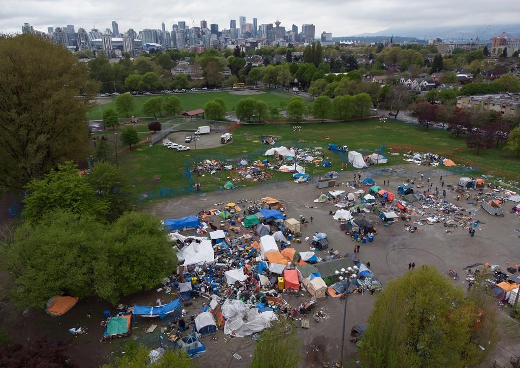 Tents and other structures are seen in an aerial view at a homeless encampment at Strathcona Park in Vancouver, B.C., Friday, April 30, 2021. THE CANADIAN PRESS/Darryl Dyck.