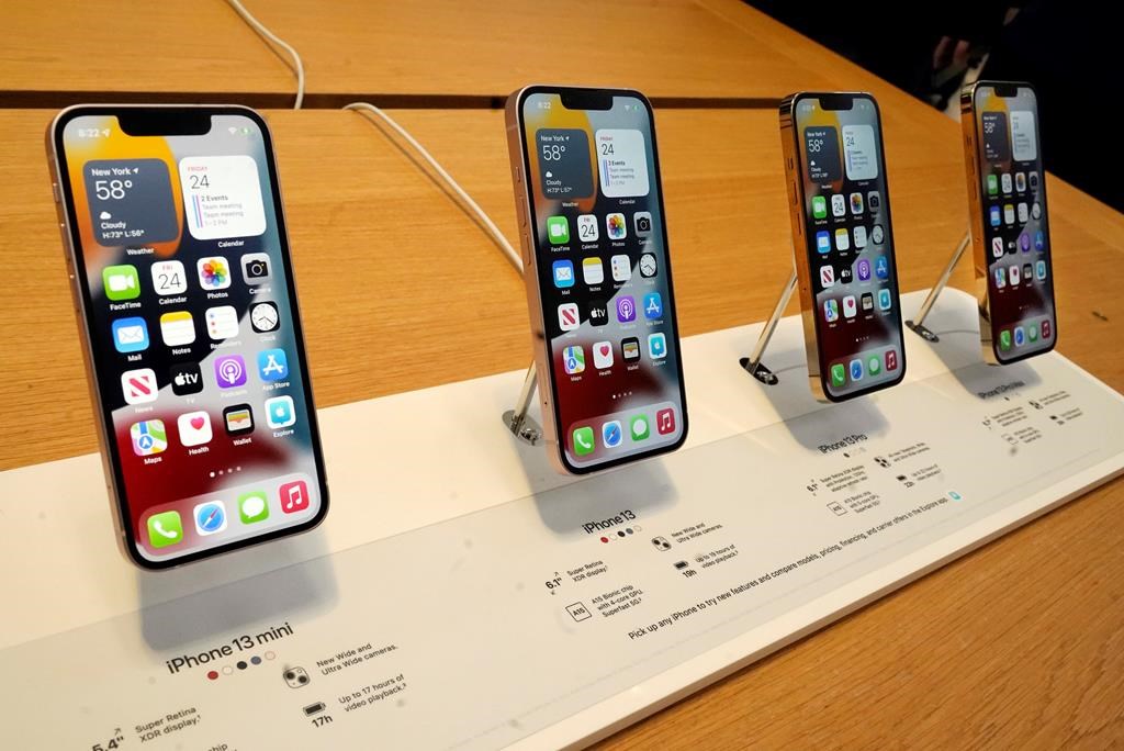 The line of the Apple iPhone 13 is displayed on their first day of sale, in New York on September 24, 2021. THE CANADIAN PRESS/AP, Richard Drew.