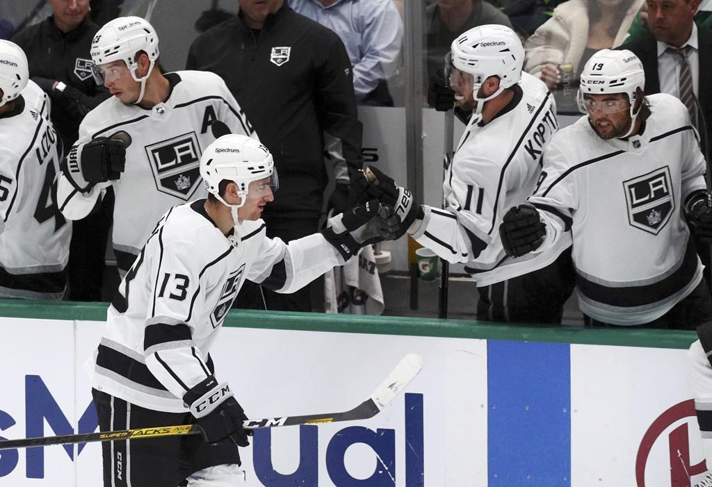 Los Angeles Kings center Gabriel Vilardi (13) fist-bumps Anze Kopitar (11) after scoring a goal against the Dallas Stars during the second period of an NHL hockey game Friday, Oct. 22, 2021, in Dallas.