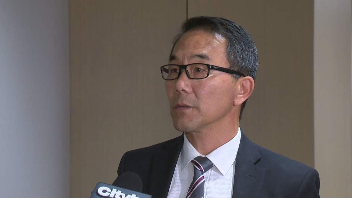Calgary councillor-elect Sean Chu addresses the media on Oct. 21, 2021, after a majority of his fellow councillors called on him to step down.