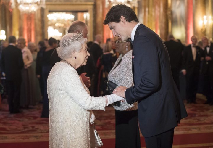 Queen Elizabeth II greets Canada’s Prime Minister Justin Trudeau in the Blue Drawing Room at Buckingham Palace in London as she hosts a dinner during the Commonwealth Heads of Government Meeting in 2018.