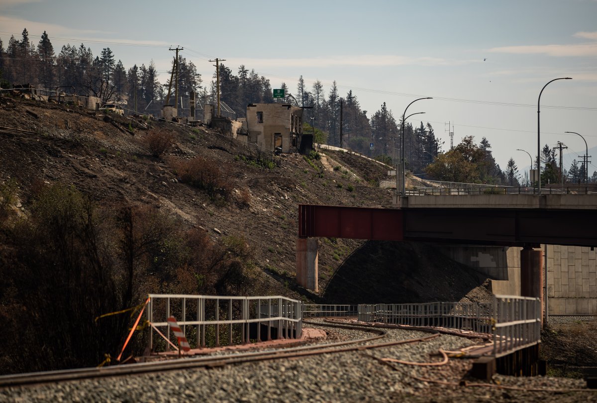 A property destroyed when the Lytton Creek wildfire swept through the community on June 30 is seen above railway tracks in Lytton, B.C., on Sunday, August 15, 2021. 