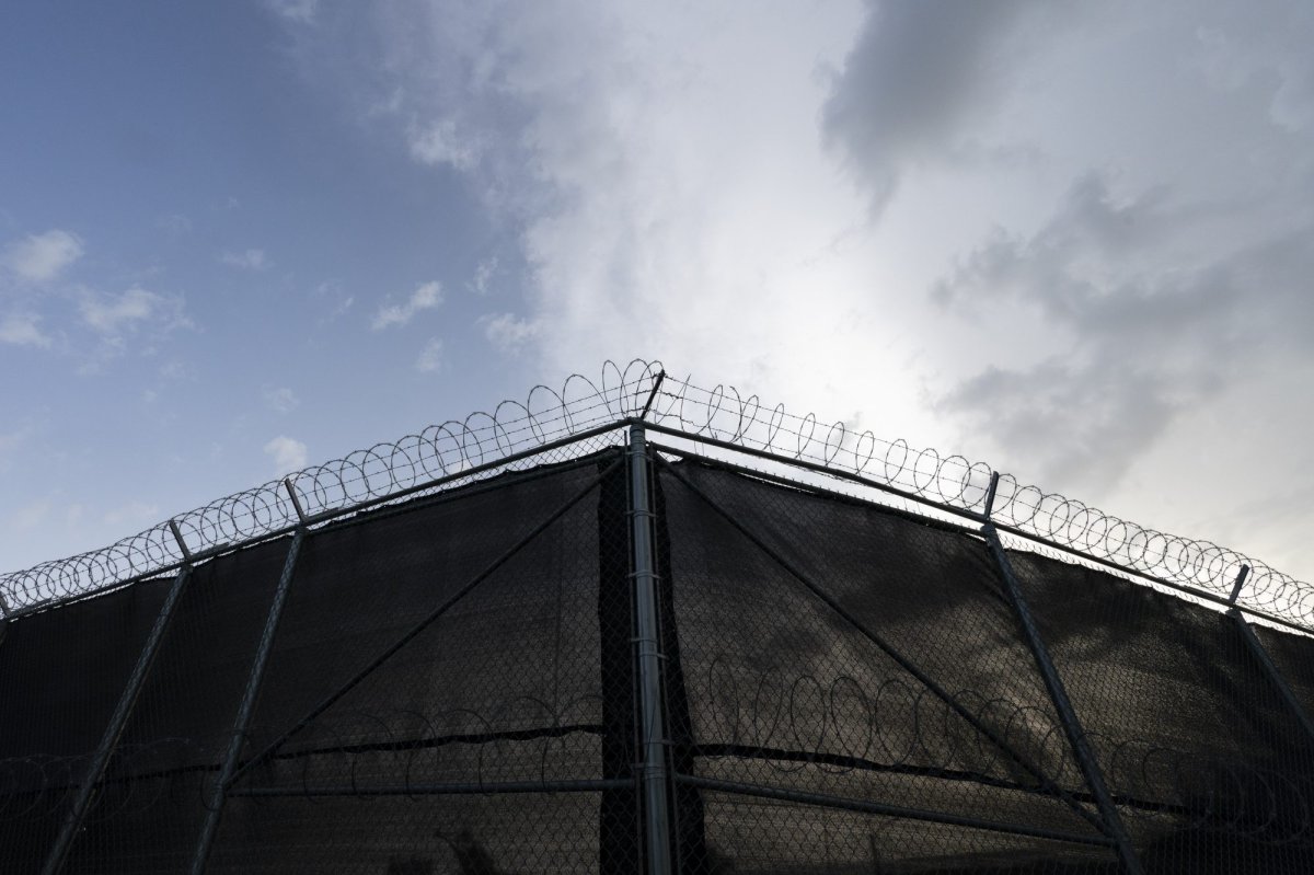 In this photo reviewed by U.S. military officials, a fence is seen at Camp Justice, Sunday, Aug. 29, 2021, in Guantanamo Bay Naval Base, Cuba. Camp Justice is where the military commission proceedings are held for detainees charged with war crimes. (AP Photo/Alex Brandon).