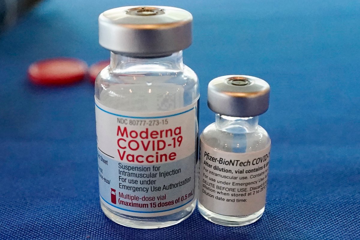 FILE - This Sept. 21, 2021 file photo shows vials of the Pfizer and Moderna COVID-19 vaccines in Jackson, Miss.