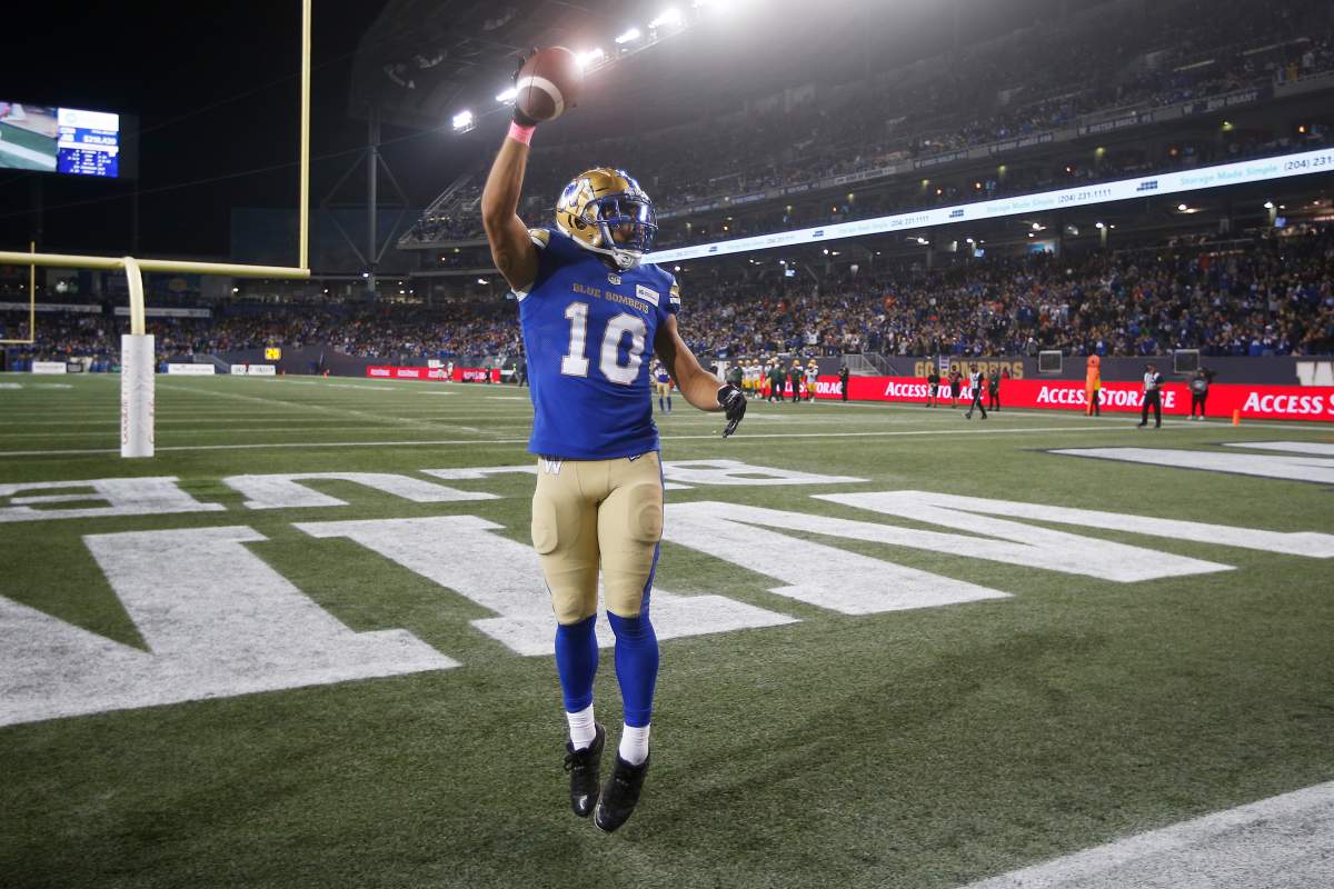 Winnipeg Blue Bombers' Nic Demski (10) celebrates his touchdown against the Edmonton Elks during the first half of CFL action in Winnipeg Friday, October 8, 2021. 