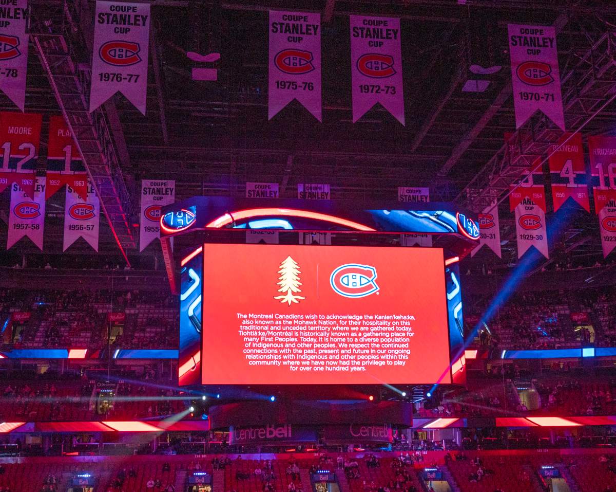 The scoreboard shows a message to accompany the Indigenous land acknowledgement before the Montreal Canadiens and San Jose Sharks hockey game Tuesday, October 19, 2021 in Montreal. 