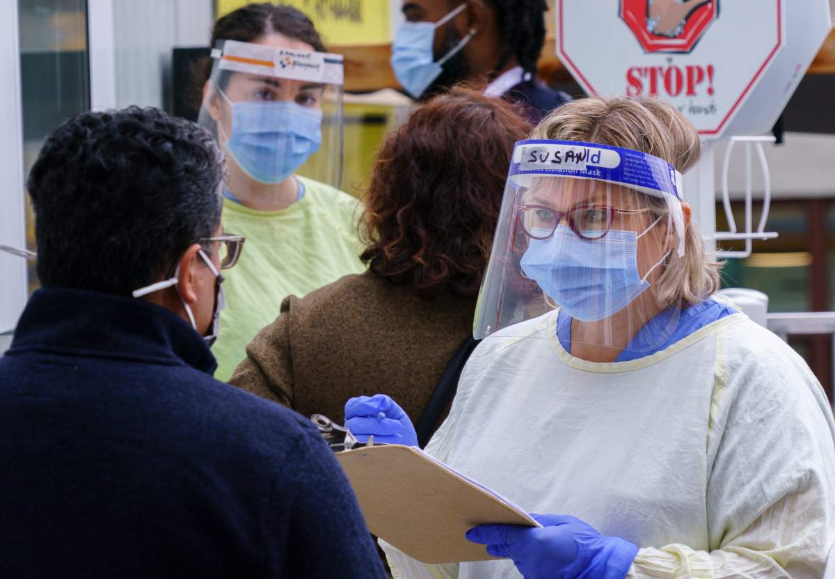 Nurses greet patients at a COVID-19 walk-in clinic in Montreal, on Tuesday, September 29, 2020.