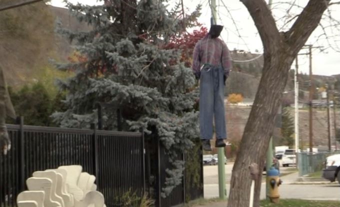 A viewer sent this photo to Global News, appearing to show a male figure hanging from a tree with a noose around its neck. Credit: Castanet