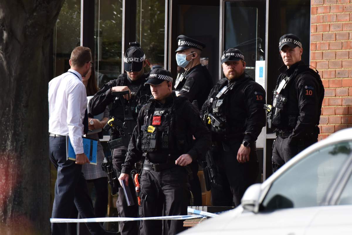 Police officers attend following the stabbing of UK Conservative MP Sir David Amess as he met with constituents at a constituency surgery on October 15, 2021 in Leigh-on-Sea, England.