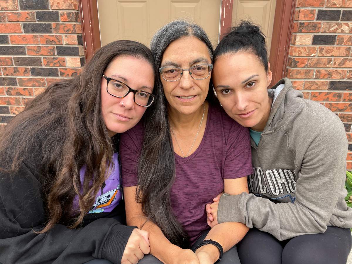 Theresa Jobse (centre) sits with her two daughters Alicia Thwaites (left) and Cindy McKague.