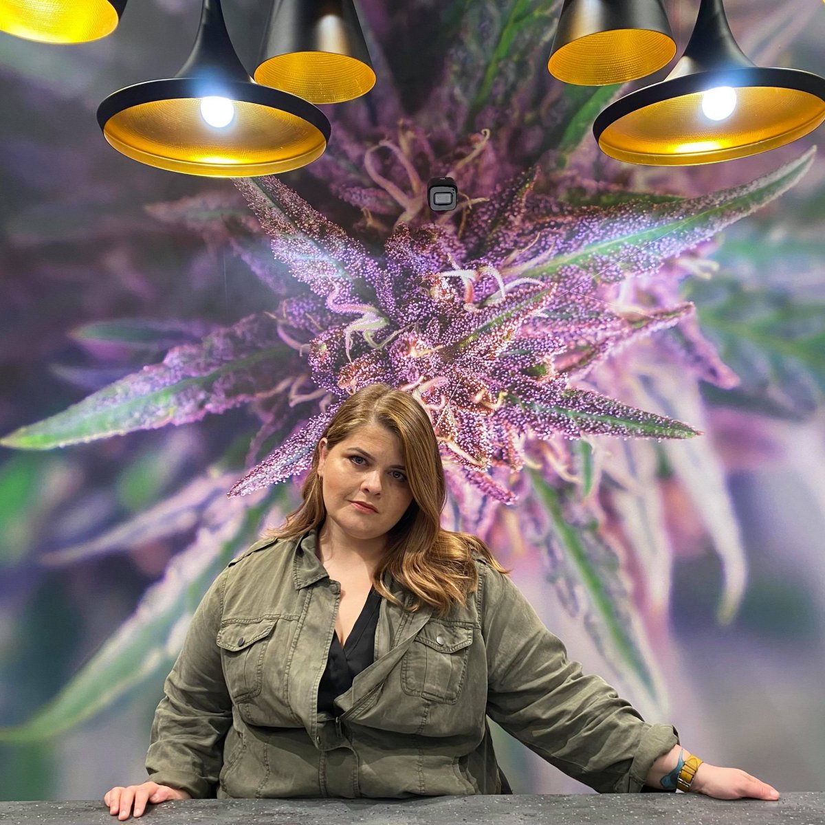 Jennawae McLean, Executive Director of NORML Canada, poses inside one of her Kingston businesses.