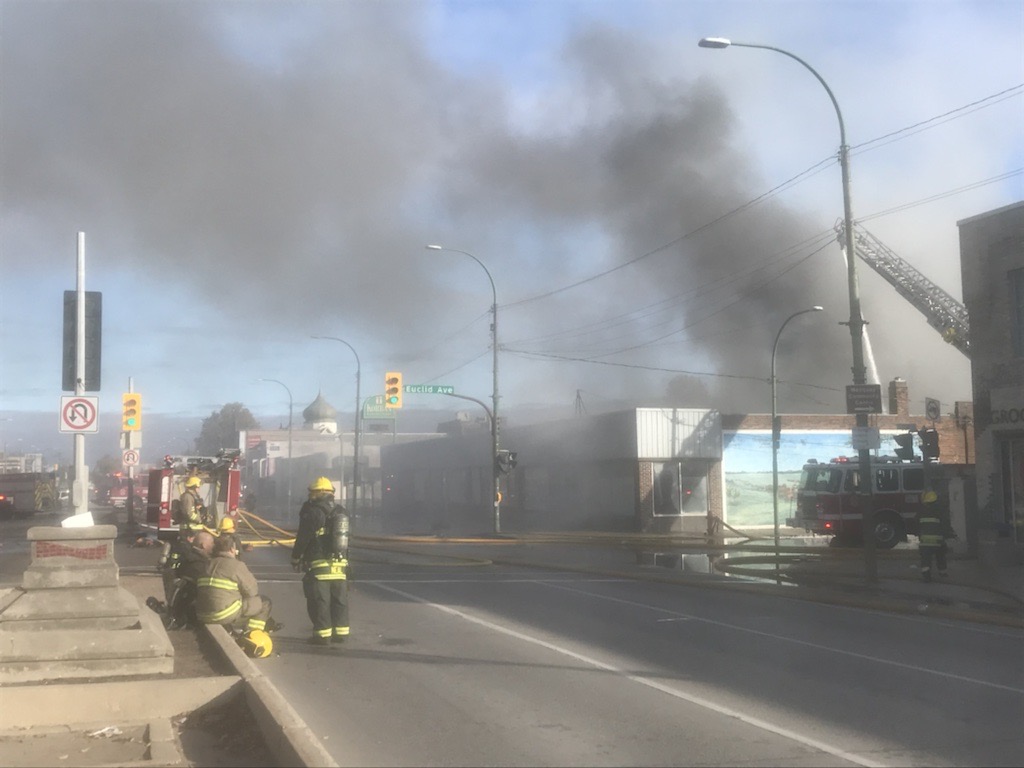 A section of Main Street near Winnipeg's downtown area is closed in both directions as crews battle a working fire in the 800 block.