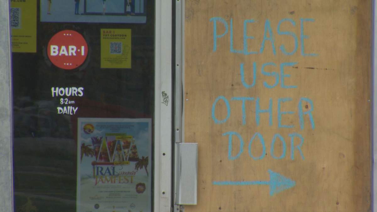 A boarded-up door at popular Corydon Avenue nightclub, Bar Italia. A shooter fired roughly a half-dozen rounds into the packed building on Saturday morning, but no one was hurt.