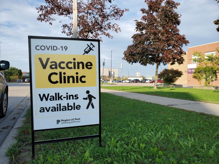 A sign for a COVID-19 vaccine clinic is seen in Mississauga.