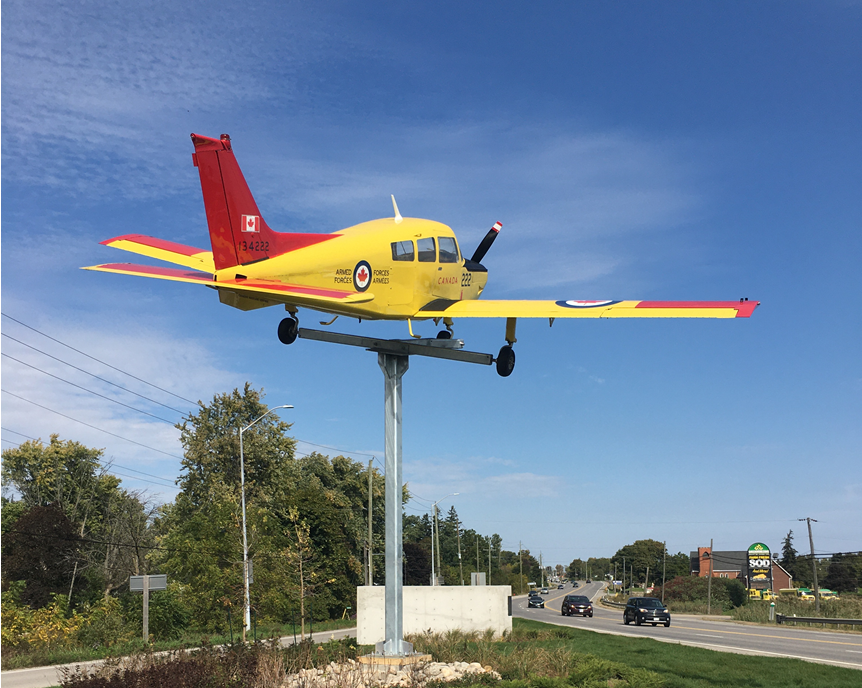An historic Beechcraft CT-134 Musketeer has been installed as the main feature of the Mount Hope Village gateway.