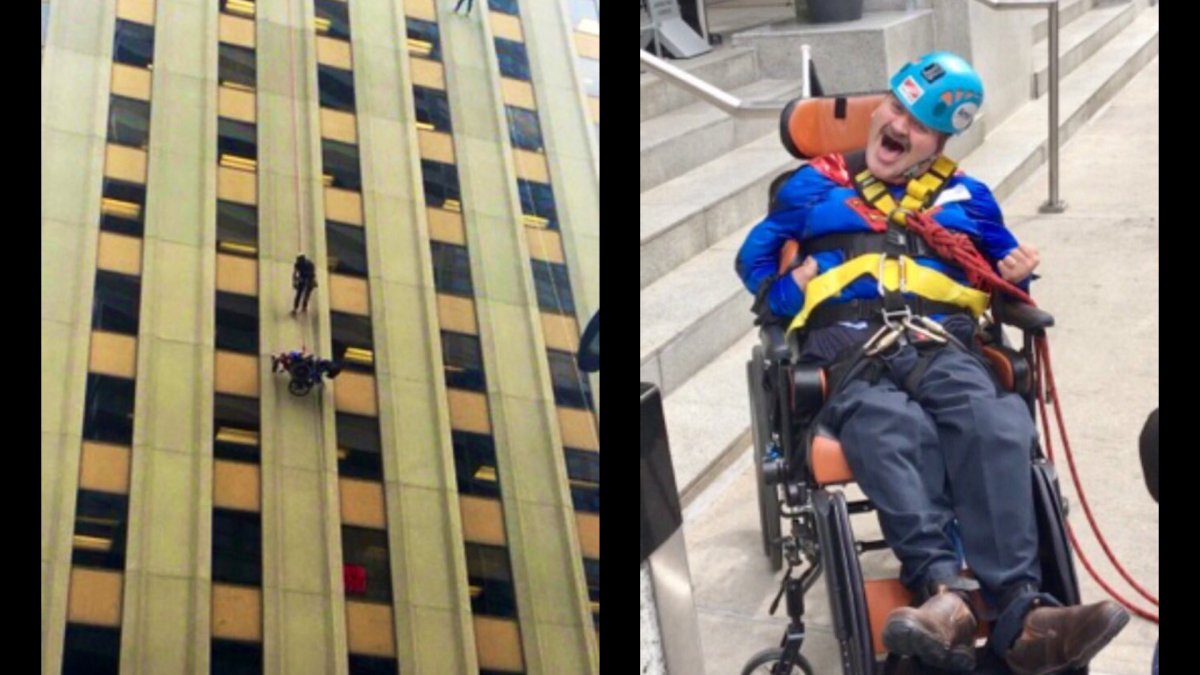 Andrew Nielsen hooked into a harness was hoisted to the top of a 23-storey building in Toronto on Oct. 11, 2018. He was rappelled back down as part of Drop Zone Toronto, an Easter Seals fundraiser.