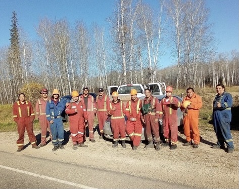 Fire fighters assembled to protect Shoal Lake and Red Earth Cree Nations.