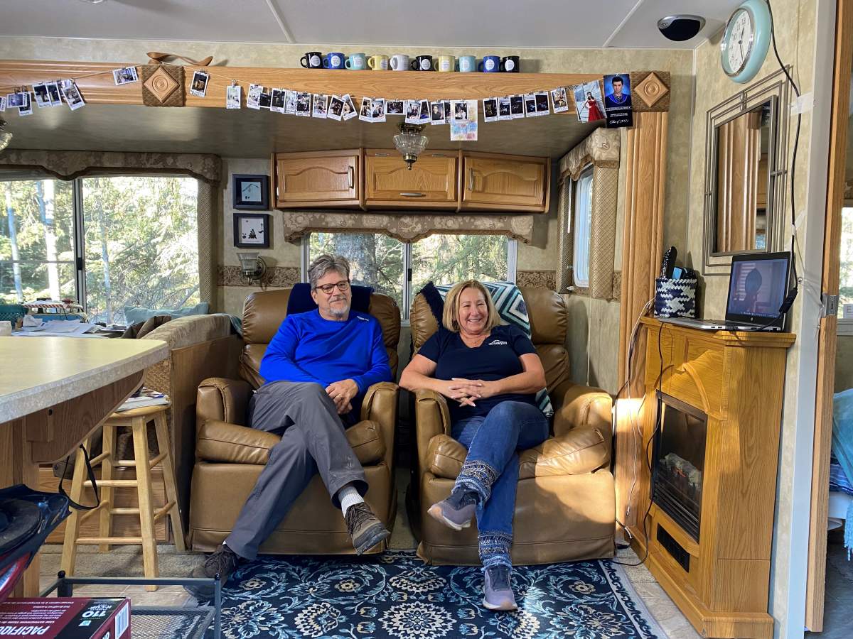 Kathy Dougall and her husband inside their RV at the Wilderness Village Resort campground, located about 20 kilometres northwest of Rocky Mountain House, Alta. on Thursday, Oct. 21, 2021.