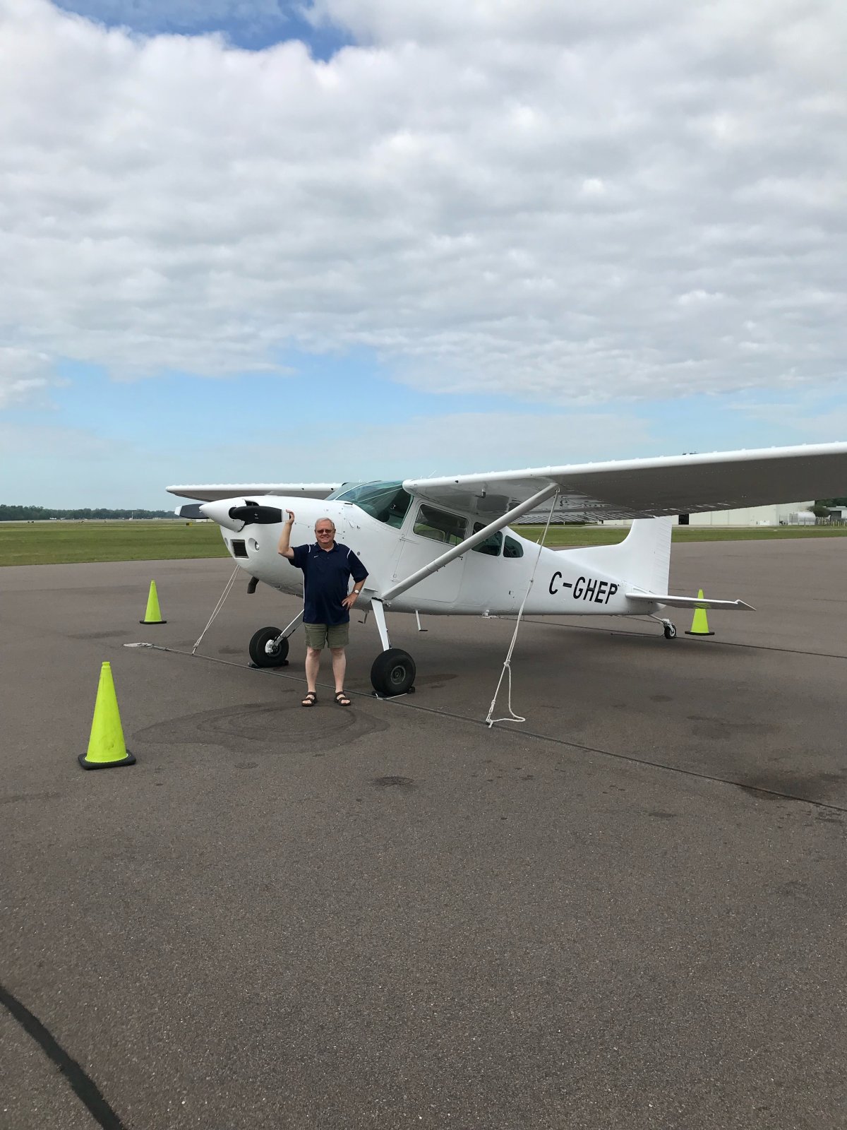 Ronald Jenson stands with his 1973 Cessna 185 after it's restoration had been completed.